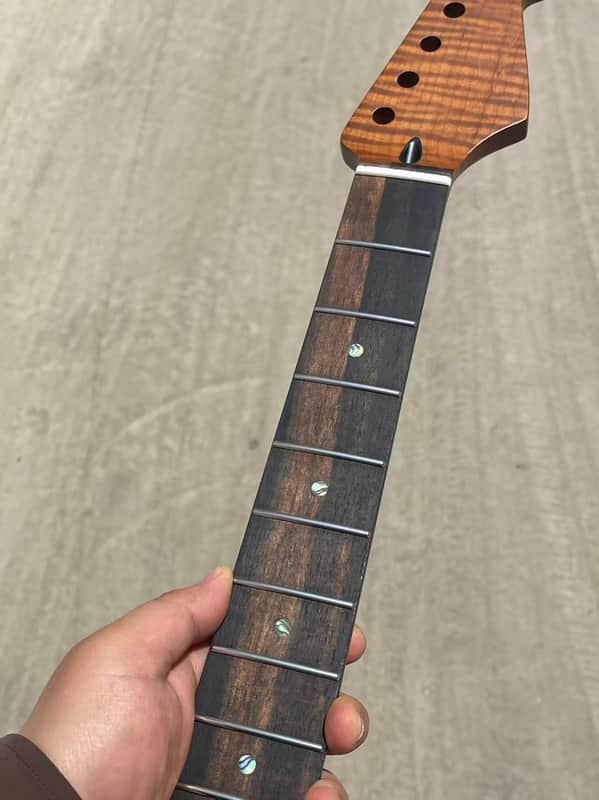 5a Striped Ebony Fretboard 22frets 5a Roasted flame Maple guitar neck Radius 12inch Round stainless steel 22 frets Roasted flame Maple guitar neck Striped Ebony fingerboard 25.5inch hole 10mm Radius: 12 inches. image 1