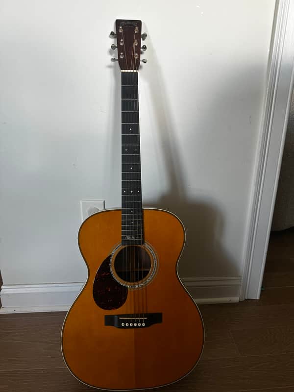 Yellow and brown electric guitar in open case, visible neck and body.