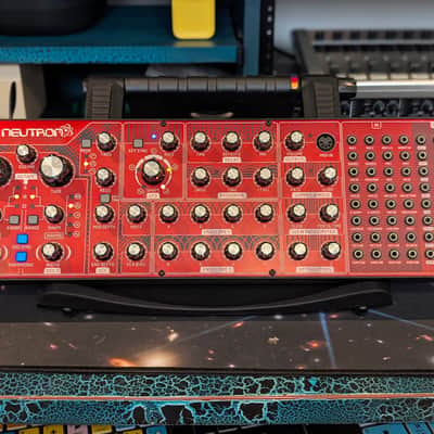 Behringer Neutron — paraphonic analog semi-modular synth, dual Curtis 3340 VCOs, self-oscillating multi-mode filter, BBD delay, overdrive, full 56-point patch bay. MIDI in/thru, USB.