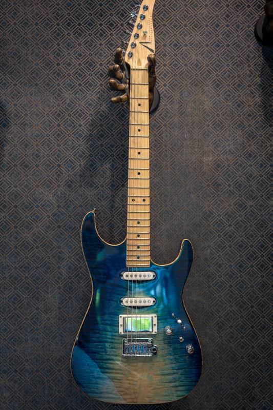 Blue and orange sunburst electric guitar with black hardware.