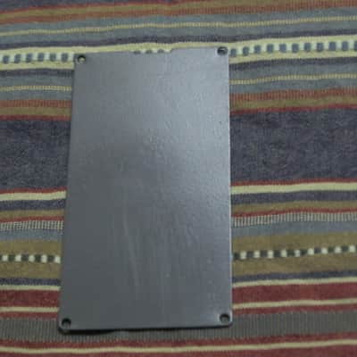 used Boss bottom plate (NO: rubber padding,label,serial number) for compact sized pedal - specifically from mid 1980s - metal, OUTER side: semi-gloss gray fiish / INNER side: flat gray finish -- back end has factory made small cut out for power jack image 2