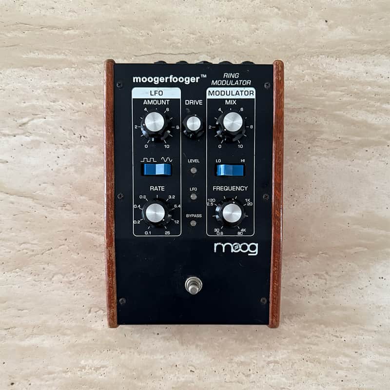 Black Moogerfooger Ring Modulator with wooden trim, knobs visible.