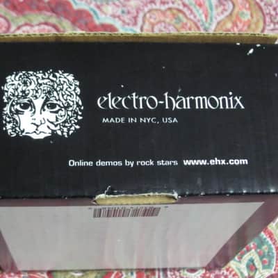 less than light average wear condition Electro Harmonix EMPTY BOX and original Owner's Manual ONLY for EXO Metal Muff with Top Boost pedal (NO pedal, NO warranty / registration paperwork) BOX: Cardboard / BOX Color: Black / GRAPHIC: Black & White, White image 12