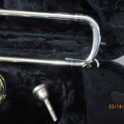 New Gold color trigger trombone. With case and mouthpiece. image 4