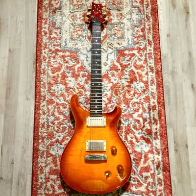 with a Flame Maple top, Mahogany neck with a Wide-Fat profile, East Indian Rosewood fretboard with moon inlays, Straight stoptail bridge, McCarty treble and bass pickups, finished in McCarty Sunburst, with nickel hardware. image 1