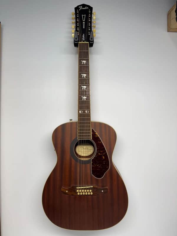 Black Fender acoustic guitar with brown wood body and tortoiseshell pickguard.