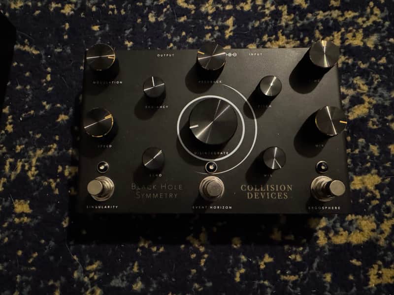 Collision Devices Black Hole Symmetry