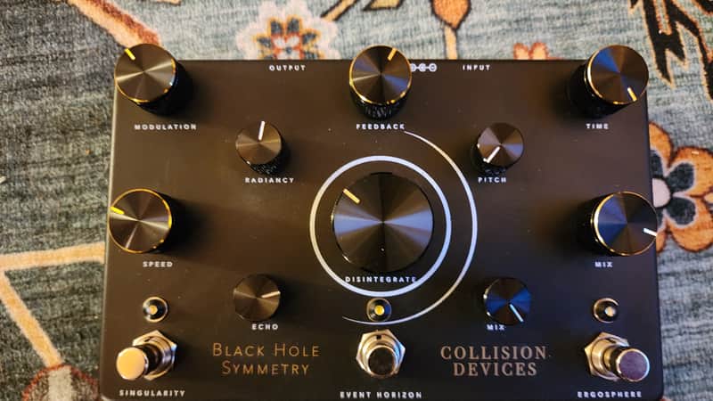 Collision Devices Black Hole Symmetry