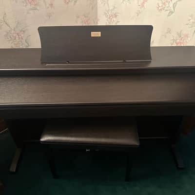 Casio Celviano AP-38 2005, keyboard (black) with matching stand and bench.
