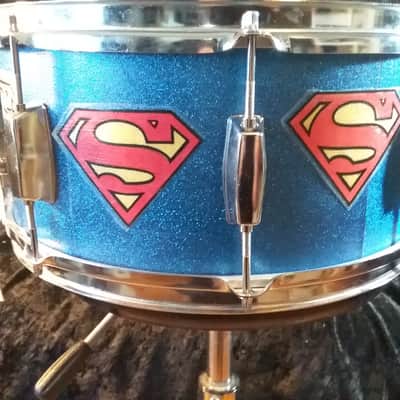 Pearl Export custom Assaulted Battery two color Superman themed graphics over a blue sparkle wrap. image 2