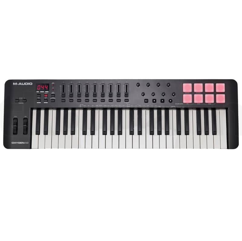 Black MIDI keyboard controller with white keys, M-Audio branding visible.