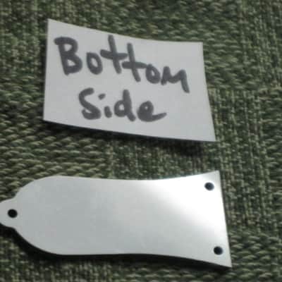 open package (near A+) unknown brand Epiphone 3 Hole Truss Rod Cover, blank (NO info), 2 ply (black front side / white bevelled edge, & white back side), bell shape + silver screws (TOP SIDE of cover has clear plastic over it), from 2020s image 20