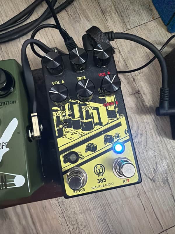 Black guitar effects pedal with knobs, labeled "385 Dynamic Overdrive.