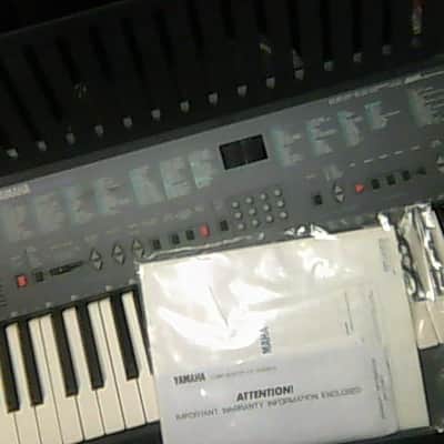 Yamaha psr-200 black plus a stack of learning keyboard books image 2