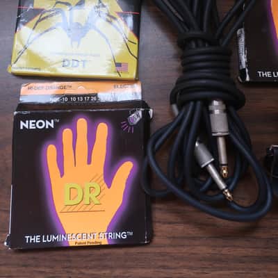 Quick I Have A Heavy Metal Gig Next Week 1 Guitar Strap 1 15 Foot Cable 2 Packs Neon DR Strings 9 Light Gauge With 1 Drop DR Tuning Pack 5 Heavy Hard Pick Set & Capo Neon luminescent (glow-in-the-dark) image 4