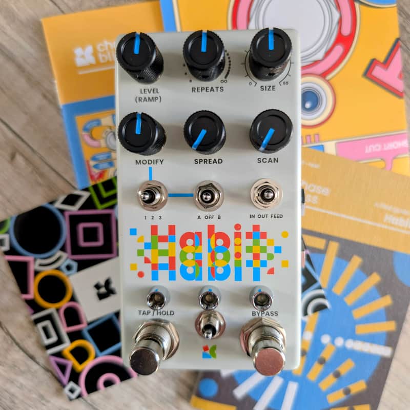 Yellow guitar effects pedal with knobs, switches, and labeled controls.