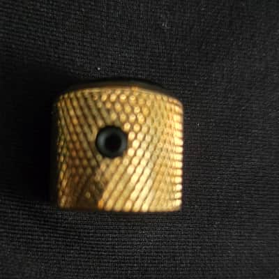 Gold and black tone knob with screw image 3
