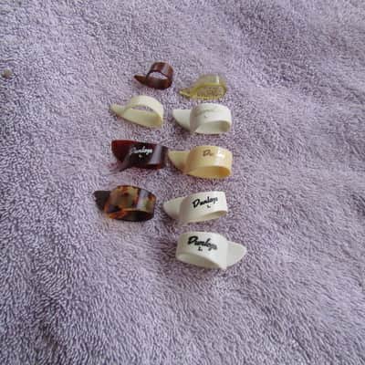 National Dunlop Unlabeled Thumb Picks Lot Of 9 Thumb Picks 1 Is Left Handed 1 Says Dobro Cool! image 1