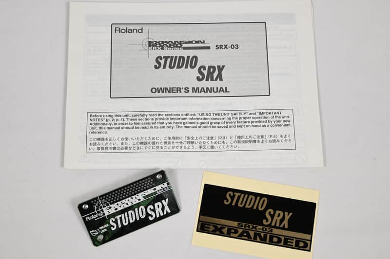 Roland Studio SRX music production software box art, dark tones, musical equipment visible.