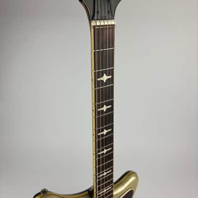 EKO 500/V3 1960s Silver Metalflake finish on top Black back and sides., Rosewood bound Fingerboard, all Switches/ Pickups working!!!, Tremelo, padded gigbag included. image 2