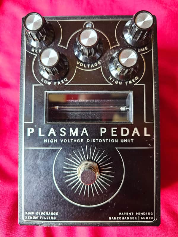 Black electronic pedal with knobs labeled Blend, Voltage, Volume, Low Freq, High Freq.