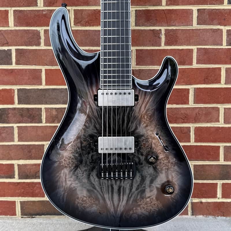 Mayones Regius Core 7 B26.5, Galaxy Eye Black, 5A Maple Burl Top, Black Limba Body, 11pc Wenge/Mahogany/Purpleheart/Maple Neck, Ebony Fretboard, Hipshot Bridge, Clockwork Knobs, Velvetrone Ironside + Solium Pickups, Mayones Hybrid Double Deck Case