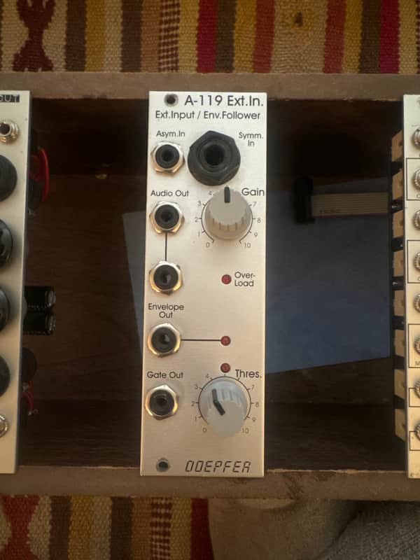 Silver electronic module with knobs and jacks, labeled "A-119 Ext.In.