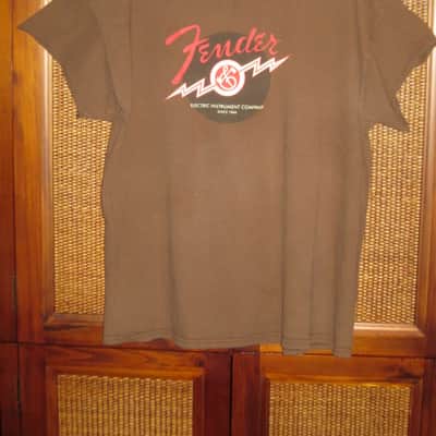 pre-owned genuine Fender Lightning Bolt Logo Short Sleeve, Cotton T-Shirt, XL, Brown (sleeves cut shorter) PN: 9101008621, from 2010, GRAPHIC: Red, Creme, Dark Brown, Fender, Ligntning Bolt, Circles, musical symbols, Electric Instrument Company Since 1946 image 2