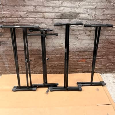Various Piano Stands Including Two on Stage Stands image 1