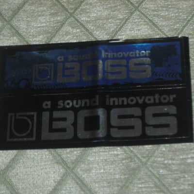 never used genuine BOSS sticker sheet (1 sheet has 2 stickers) 1) BOSS a sound innovator - colors Silver, Blue, Black Silver & 2) BOSS a sound innovator - colors Silver & Black (specifically from 1988), was orig paired w/ a DC3 Japan (pedal NOT included) image 1