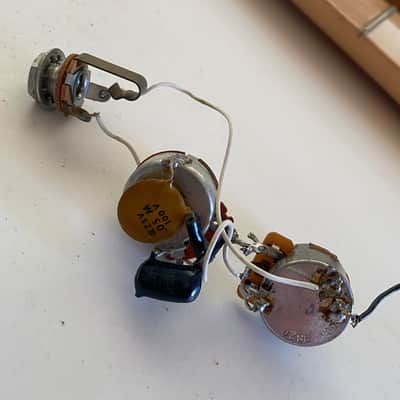 Late '70s wiring harness from a Fender Musicmaster bass. Pots, caps, output jack image 1