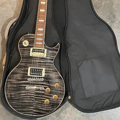 Full Warranty NEW OPEN BOX W/Canvas Gig Bag, Wall Hanger & Accessory Bundle Vintage V100-TBK Reissued Series Single Cut 2010s - Flamed Trans Black image 7