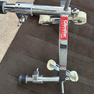 GIBRALTAR GCS-L Large Conga Stand: Heavy-duty stand with a triangular design for 11 3/4" and 12 1/2" congas. 2000 - SILVER WITH BEIGE ROLLERS image 1
