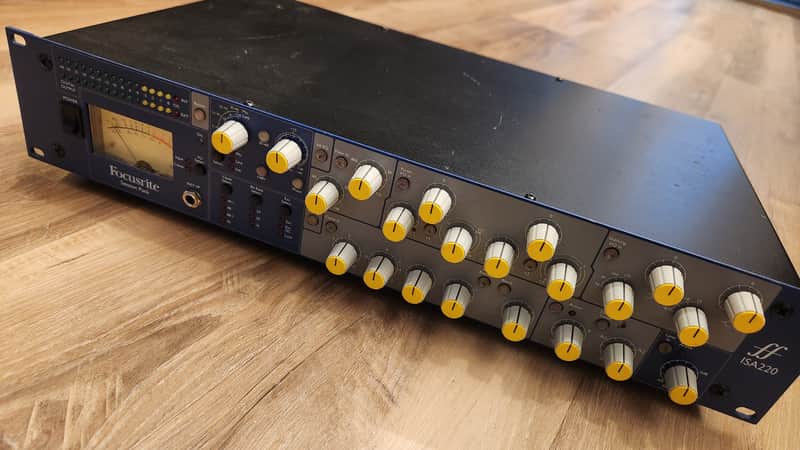 Focusrite ISA220 preamp, silver and grey, visible knobs and meters.