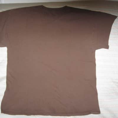 pre-owned genuine Fender Lightning Bolt Logo Short Sleeve, Cotton T-Shirt, XL, Brown (sleeves cut shorter) PN: 9101008621, from 2010, GRAPHIC: Red, Creme, Dark Brown, Fender, Ligntning Bolt, Circles, musical symbols, Electric Instrument Company Since 1946 image 9