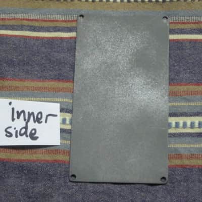 used Boss bottom plate (NO: rubber padding,label,serial number) for compact sized pedal - specifically from mid 1980s - metal, OUTER side: semi-gloss gray fiish / INNER side: flat gray finish -- back end has factory made small cut out for power jack image 15