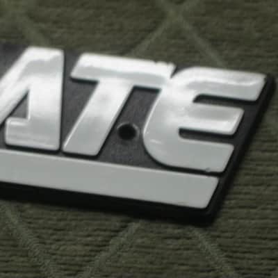 used - some imperfections genuine Crate bass amp Crate LOGO Plate (badge)- hard plastic - with 2 original screws (from a BX15 or BX25 bass amp - NO bass amp included) 1990s - early 2000s - Hard Plastic, white & black image 20