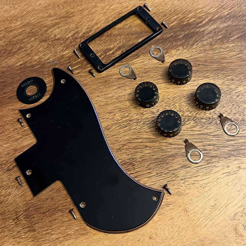 Original 1974 Gibson SG bundle: pickguard, poker chip, one pickup ring, 4 speed knobs, 4 pointer washers, period screws image 1