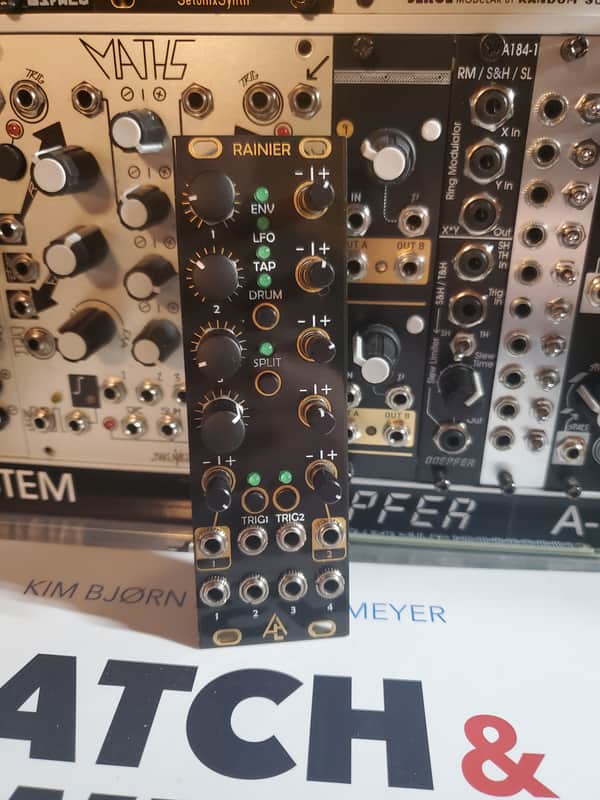 Black electronic synthesizer module with knobs, switches, and labeled controls.