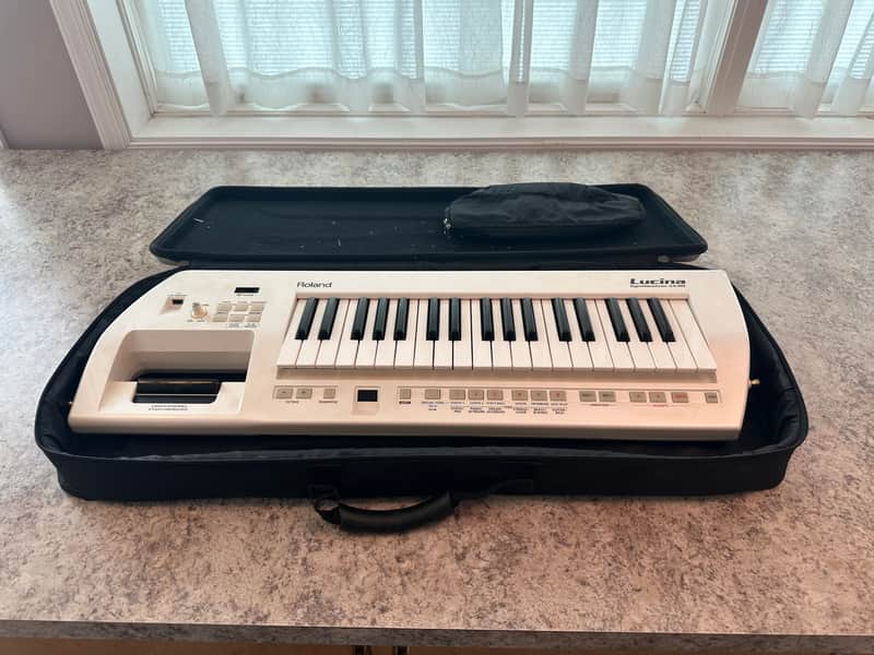 Roland AX-09 Lucina 37-Key Keytar Synthesizer | Reverb