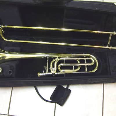 New Gold color trigger trombone,  With case and mouthpiece image 1