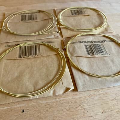 Four Single .046 Gauge Acoustic Guitar Strings (Ernie Ball) Opened, Not Played image 2