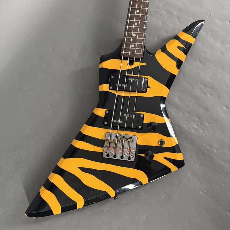 Aria Pro II ZZB Deluxe Explorer Bass Black Yellow Zebra/Tiger