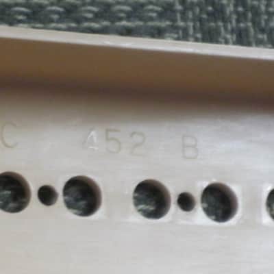 mostly very clean 1990s Gibson P-100 Soapbar pickup with Creme Cover (but can sell with black cover instead) NO mounting screws 6.3k - ideal for NECK position (2 conductor, solder connect) a P100 is a stacked humbucker that's hum-cancelling image 5