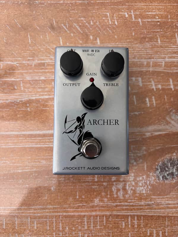 Silver guitar effects pedal with knobs and "ARCHER" logo.