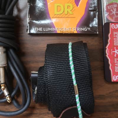 Quick I Have A Heavy Metal Gig Next Week 1 Guitar Strap 1 15 Foot Cable 2 Packs Neon DR Strings 9 Light Gauge With 1 Drop DR Tuning Pack 5 Heavy Hard Pick Set & Capo Neon luminescent (glow-in-the-dark) image 3