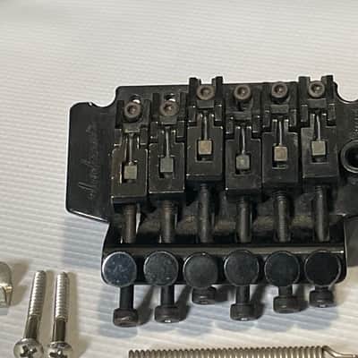 1990's Jackson King V & Dinky Guitars JT-580 Takeuchi Black Licensed Floyd Rose Tremolo Guitar Bridge image 4
