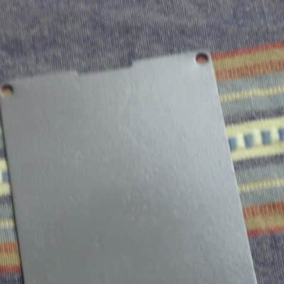 used Boss bottom plate (NO: rubber padding,label,serial number) for compact sized pedal - specifically from mid 1980s - metal, OUTER side: semi-gloss gray fiish / INNER side: flat gray finish -- back end has factory made small cut out for power jack image 12