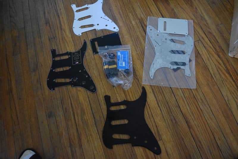 Mixed guitar and gear accessory lot, over 50 items, hardware , strings, tools, pickguards, ect. image 1