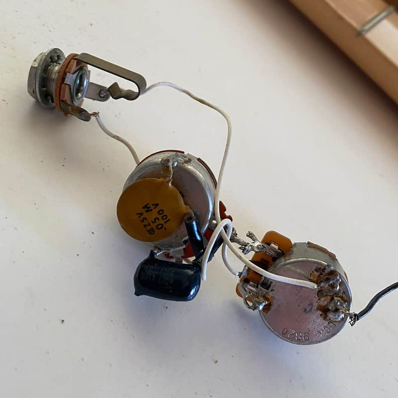 Late '70s wiring harness from a Fender Musicmaster bass. Pots, caps, output jack image 1